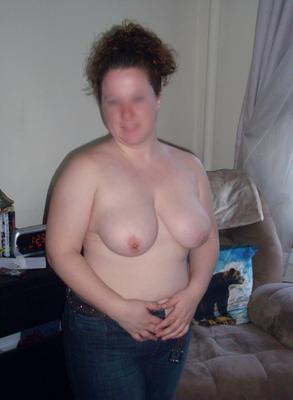 Just standing topless, showing off my titties say hi to me