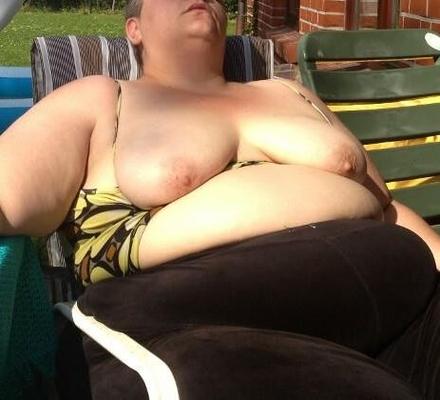 Fat KG german MILF flashes anging tits and belly in the sun
